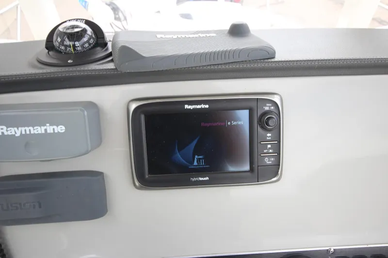 Slide: The Image of Raymarine navigation system on 2014 Boston Whaler 210 Dauntless boat dashboard. - 20