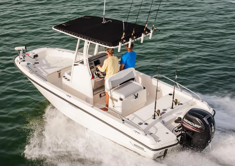 Slide: The Image of Manufacturer Provided Image: 2014 Boston Whaler 210 Dauntless boat cruising on water. - 25