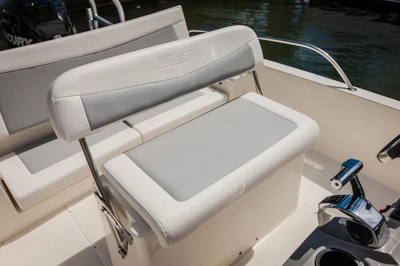 Slide: The Image of Manufacturer Provided Image: 2014 Boston Whaler 210 Dauntless boat seating and console area. - 32