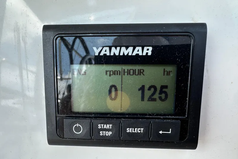 Slide: The Image of Yanmar engine hour meter displaying 125 hours on Jeanneau Sun Odyssey 410, 2024 model. - 27