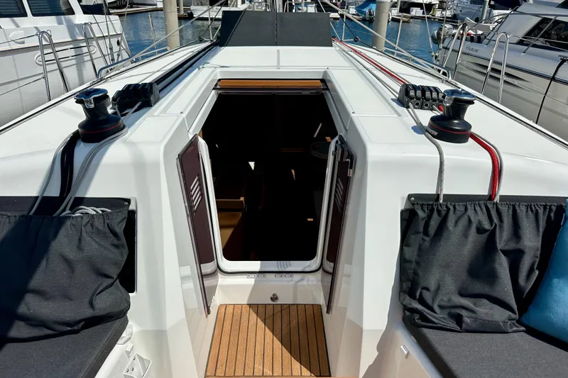 Slide: The Image of 2024 Jeanneau Sun Odyssey 410 yacht cockpit with open companionway and winches. - 45