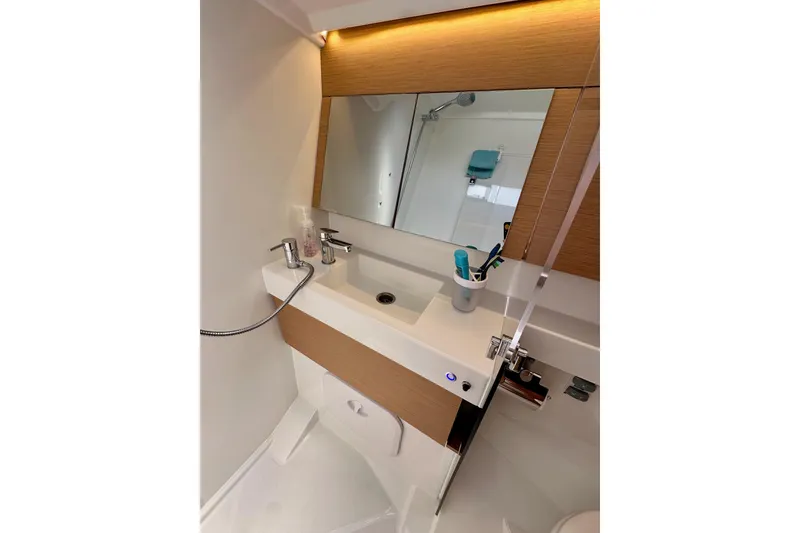 Slide: The Image of 2024 Jeanneau Sun Odyssey 410 bathroom with modern sink and mirror. - 66