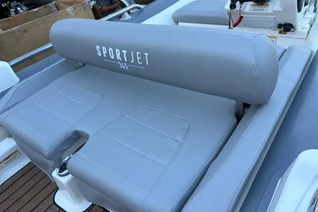 Slide: The Image of 2018 Williams 345 Sports Jet with gray seating and "SportJet 345" branding. - 6