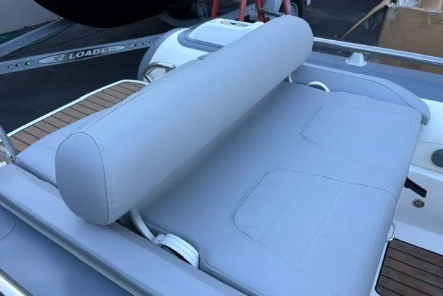 Slide: The Image of 2018 Williams 345 Sports Jet boat with gray cushioned seating and teak deck accents. - 7