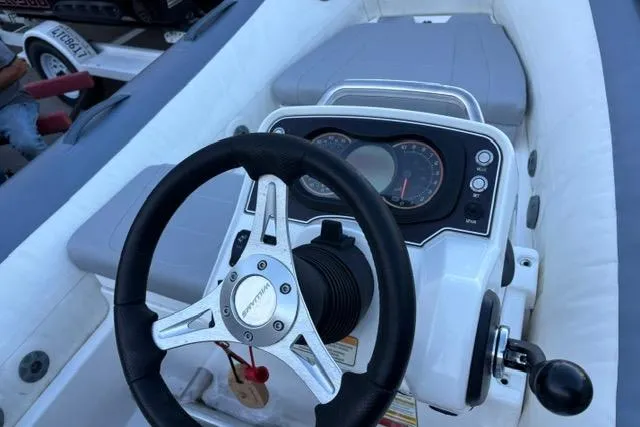 Slide: The Image of 2018 Williams 345 Sports Jet dashboard with steering wheel and control panel. - 8