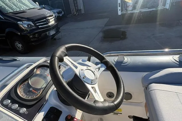 Slide: The Image of Steering wheel of a 2018 Williams 345 Sports Jet boat, with dashboard controls visible. - 9