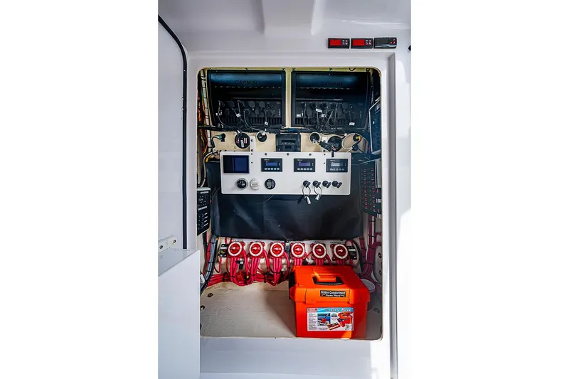 Slide: The Image of Electrical panel of a 2020 Bahama 41 boat, featuring control switches and wiring. - 17