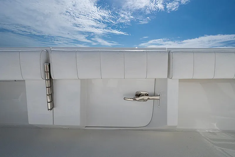 Slide: The Image of 2020 Bahama 41 boat with white upholstery and stainless steel latch under a blue sky. - 22