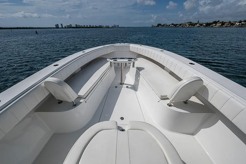 Slide: The Image of 2020 Bahama 41 boat with spacious seating, cruising on calm waters under a cloudy sky. - 4