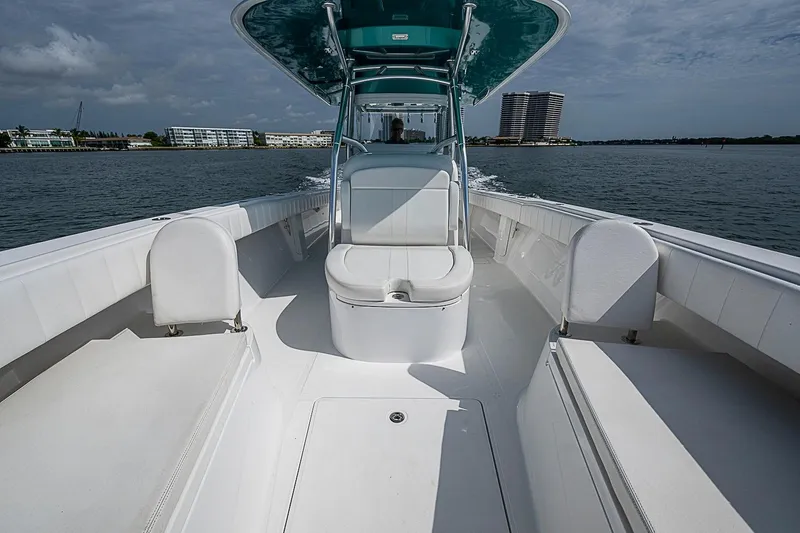 Slide: The Image of 2020 Bahama 41 boat cruising on water, featuring spacious seating and sleek design. - 8