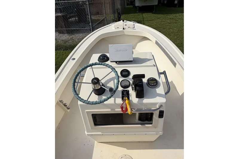 Slide: The Image of 2007 Parker 1801 Center Console boat dashboard with steering wheel and controls. - 11