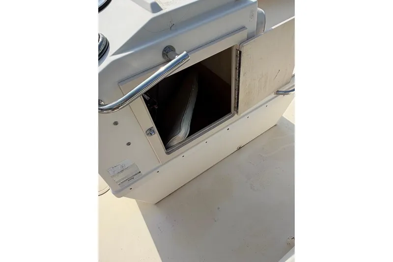 Slide: The Image of Open storage compartment on 2007 Parker 1801 Center Console boat. - 12