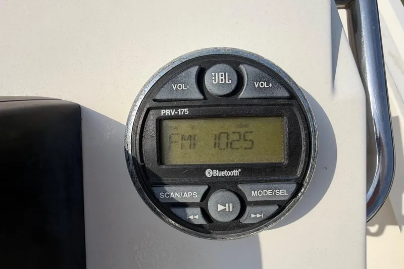 Slide: The Image of JBL PRV-175 Bluetooth stereo on 2007 Parker 1801 Center Console boat dashboard. - 15