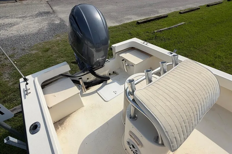 Slide: The Image of 2007 Parker 1801 Center Console boat with outboard motor and cushioned seating. - 17