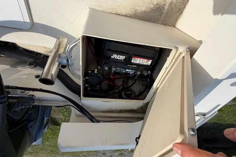 Slide: The Image of Battery compartment of a 2007 Parker 1801 Center Console boat, showing wiring and connections. - 18