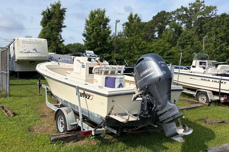 Slide: The Image of 2007 Parker 1801 Center Console boat with Yamaha engine on trailer, parked on grass. - 3