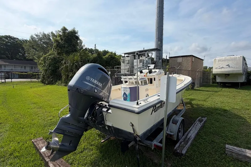 Slide: The Image of 2007 Parker 1801 Center Console boat with Yamaha engine on grassy lot. - 6
