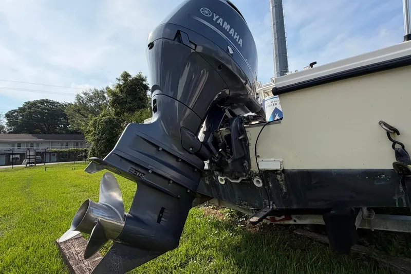 Slide: The Image of 2007 Parker 1801 Center Console boat with Yamaha outboard motor on grassy area. - 7