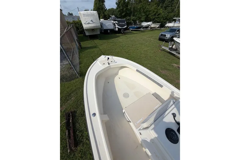 Slide: The Image of 2007 Parker 1801 Center Console boat in storage yard with other vehicles. - 8