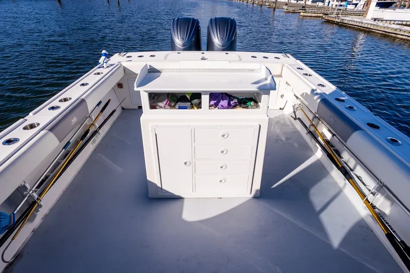 Slide: The Image of 2024 Steiger Craft 31 Fisherman boat deck with fishing rods and storage. - 14