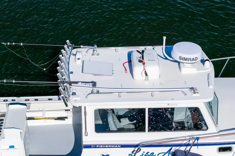 Slide: The Image of 2024 Steiger Craft 31 Fisherman boat with fishing rods and Simrad equipment on deck. - 6