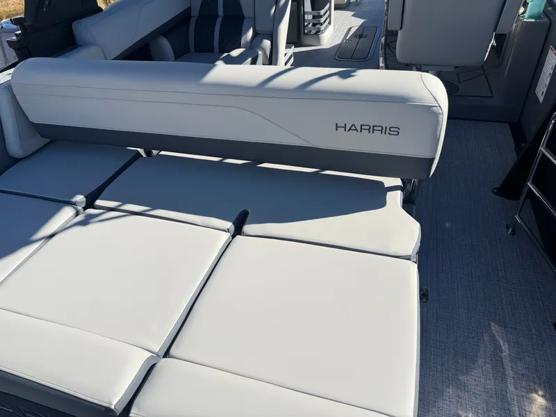 Slide: The Image of The image shows the seating areas of a Harris Grand Mariner 230 boat with gray upholstery. - 20
