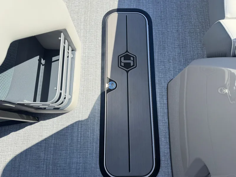 Slide: The Image of The image shows the floor of a 2027 Harris Grand Mariner 230 with a sleek design. - 11