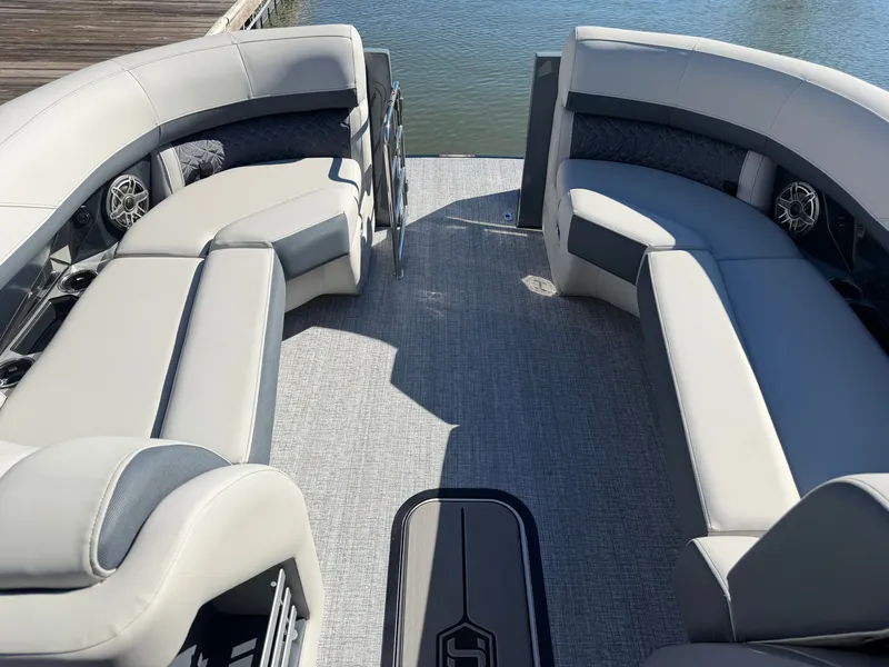 Slide: The Image of The image shows the interior of a 2027 Harris Grand Mariner 230 with sleek, gray seating. - 8