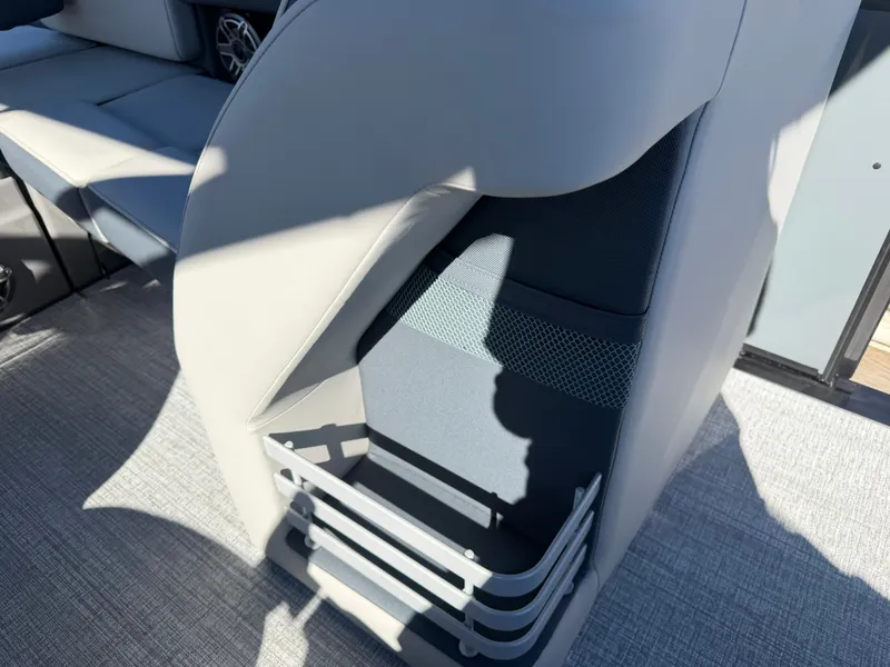 Slide: The Image of Close-up of a seating area with gray upholstery and a storage compartment. - 12