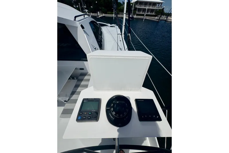 Slide: The Image of Helm station of 2023 Schionning Arrow 1280S catamaran with navigation instruments. - 19