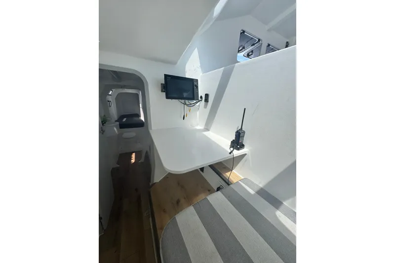 Slide: The Image of Interior of 2023 Schionning Arrow 1280S catamaran with navigation equipment. - 20