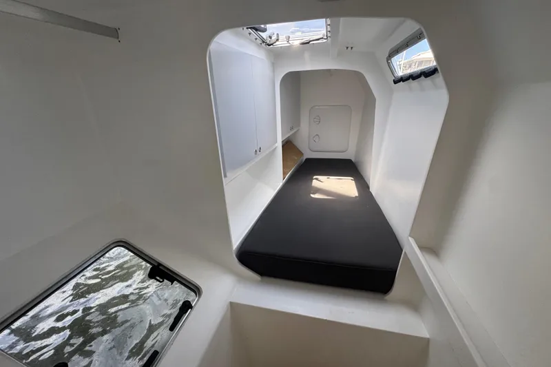 Slide: The Image of Interior cabin of 2023 Schionning Arrow 1280S catamaran with minimalist design. - 32