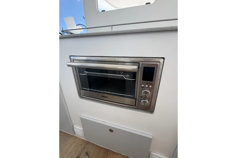 Slide: The Image of Built-in Galanz oven on 2023 Schionning Arrow 1280S yacht, featuring sleek stainless steel design. - 37