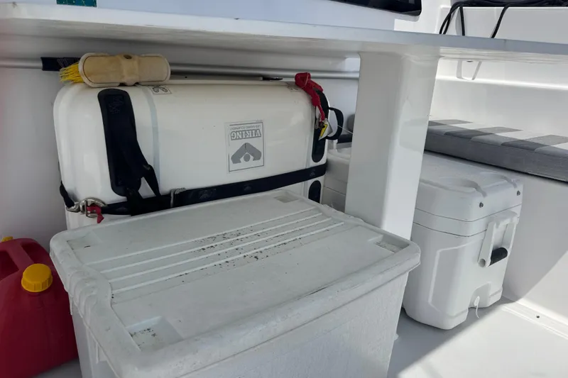 Slide: The Image of Storage area on 2023 Schionning Arrow 1280S with coolers and safety equipment. - 38