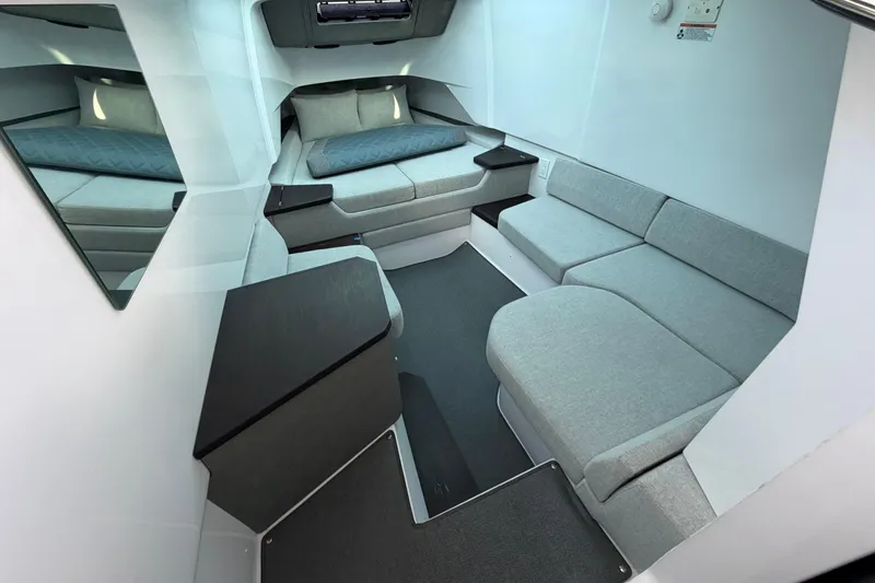 Slide: The Image of 2024 Axopar 37 Sun-Top cabin interior with modern seating and sleek design. - 14