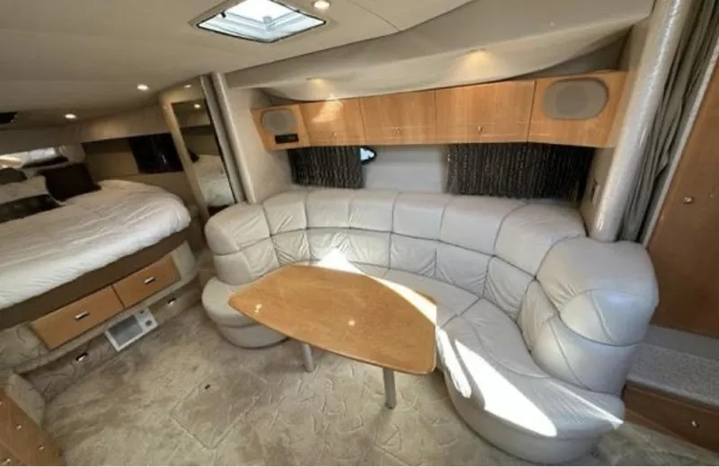 Slide: The Image of 2003 Formula 37 PC yacht interior with leather seating and wooden table. - 17