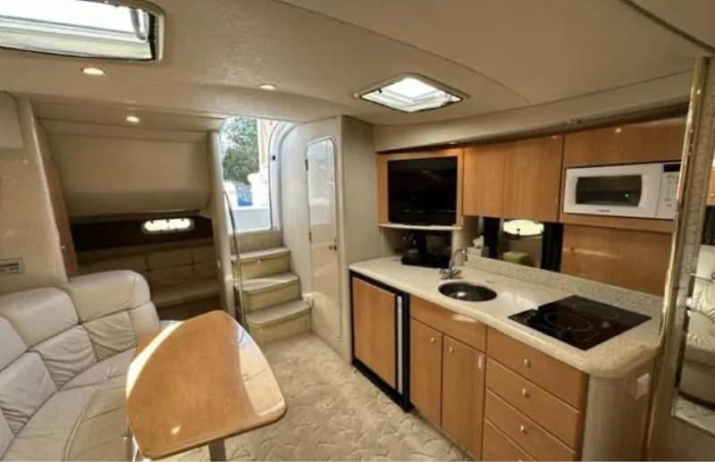 Slide: The Image of Interior of a 2003 Formula 37 PC yacht with modern kitchen and seating area. - 19