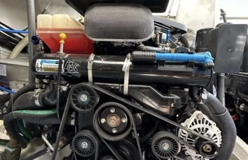 Slide: The Image of Engine of a 2003 Formula 37 PC boat, showcasing belts and components. - 28