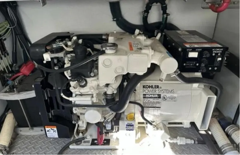 Slide: The Image of 2003 Formula 37 PC engine room featuring a Kohler power system generator. - 31