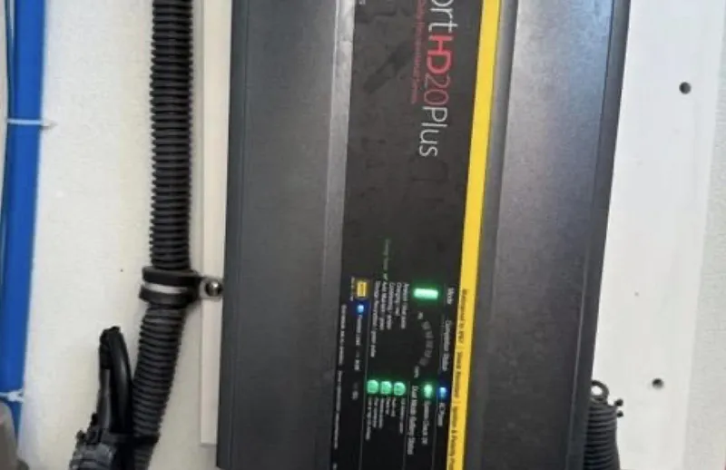 Slide: The Image of Battery charger mounted on a wall, labeled "ProSport HD20 Plus," in a 2003 Formula 37 PC. - 32