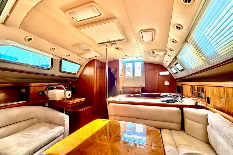 Slide: The Image of Luxurious interior of 2007 Hunter 41 Deck Salon yacht with elegant wood finishes. - 10