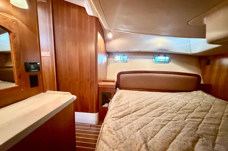 Slide: The Image of Luxurious interior of 2007 Hunter 41 Deck Salon yacht with cozy bed and wooden finish. - 26