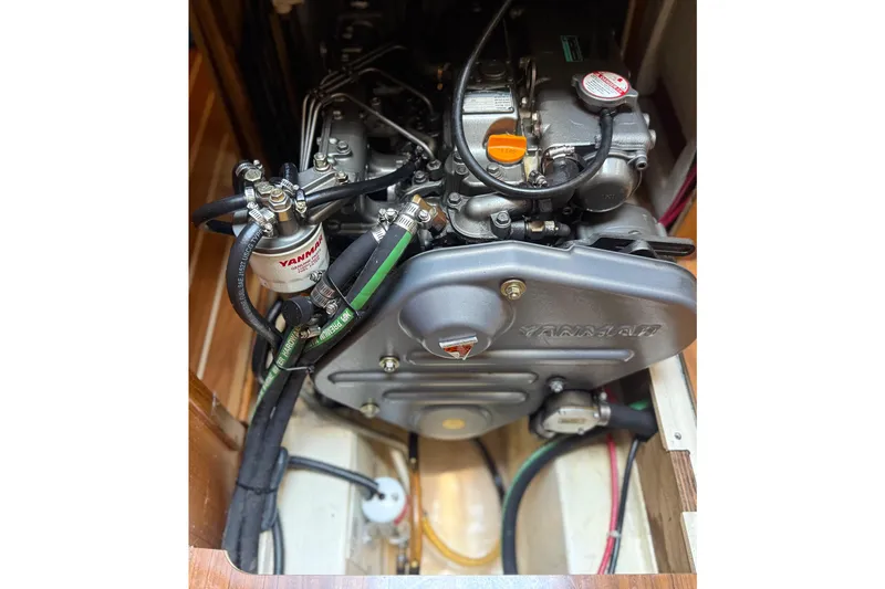 Slide: The Image of Engine compartment of a 2007 Hunter 41 Deck Salon sailboat, featuring a Yanmar engine. - 31