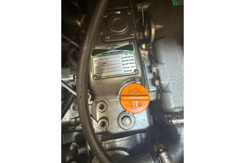Slide: The Image of Engine compartment of a 2007 Hunter 41 Deck Salon sailboat, featuring an oil cap. - 32