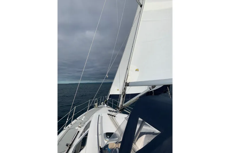 Slide: The Image of Sailing on a 2007 Hunter 41 Deck Salon under cloudy skies. - 8