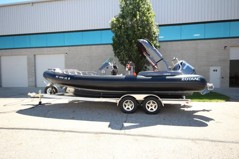 The Image of 2021 Zodiac Medline 7.5 boat on trailer outside industrial building. - 1