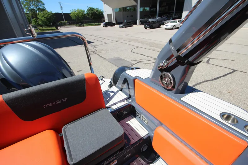 Slide: The Image of 2021 Zodiac Medline 7.5 boat interior with orange seating and modern design elements. - 11