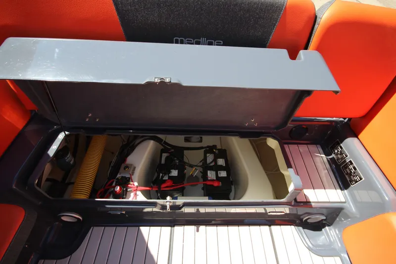 Slide: The Image of Zodiac Medline 7.5 (2021) boat storage compartment with battery and wiring. - 12