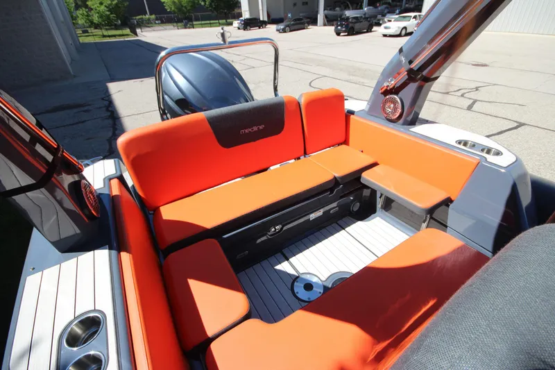 Slide: The Image of 2021 Zodiac Medline 7.5 boat interior with orange seating and modern design. - 13