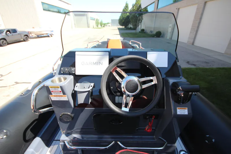 Slide: The Image of Cockpit view of 2021 Zodiac Medline 7.5 boat with Garmin navigation system. - 17